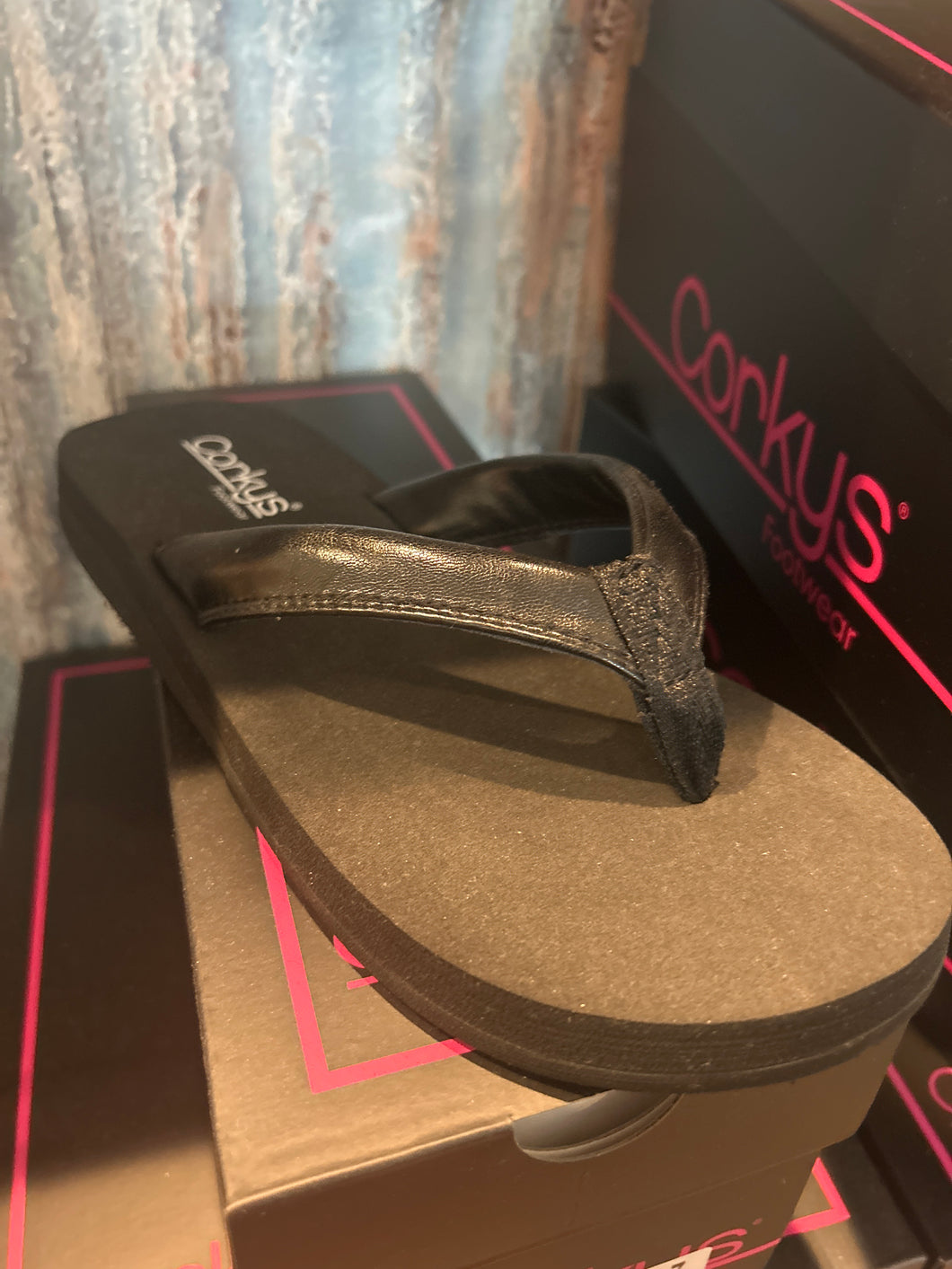 Corky’s black flip flop